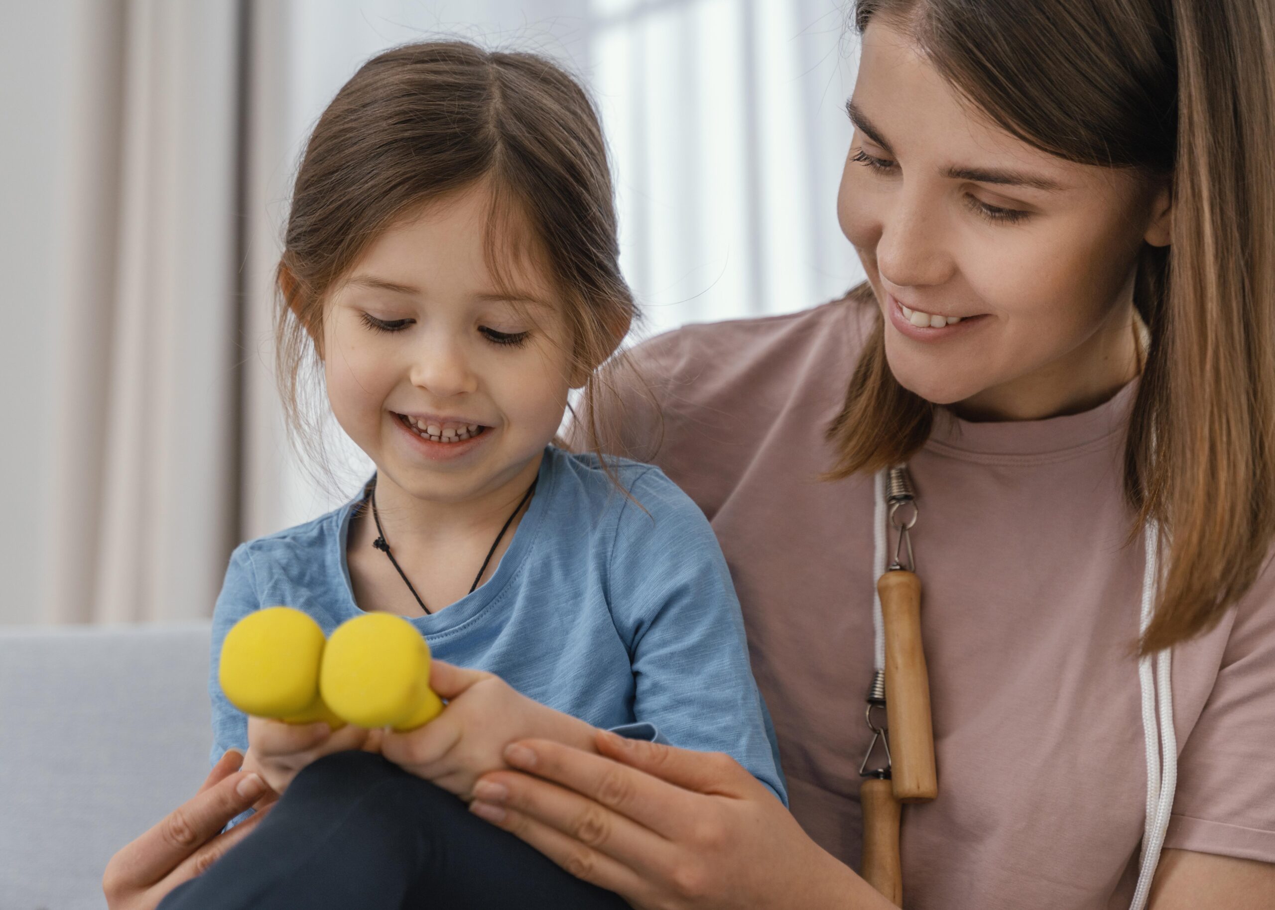 close-up-girl-holding-dumbbells
